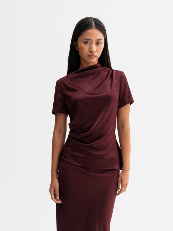 Model wearing Ahlvar Gallery Lizi satin tee in Burgundy
