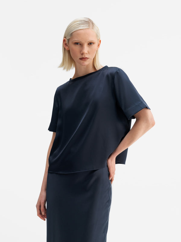 Model wearing Ahlvar Gallery Lola satin tee blue grey