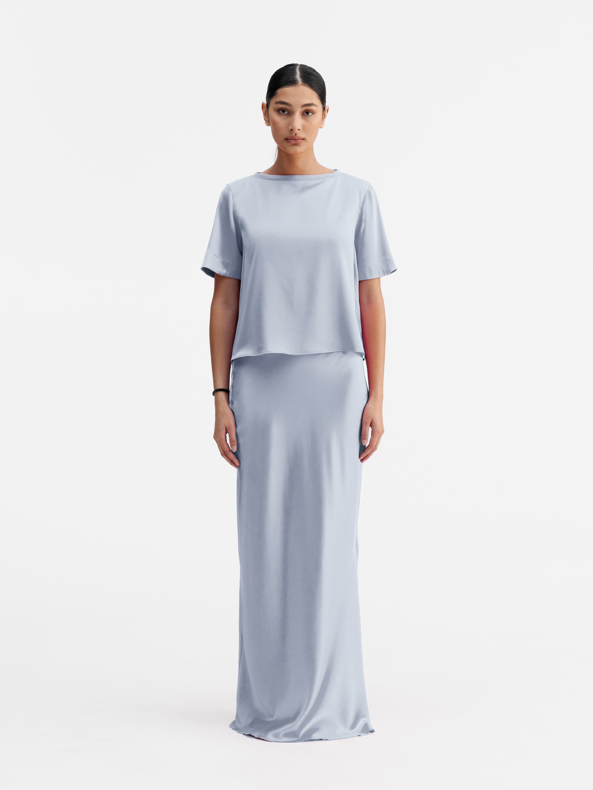 Model wearing Ahlvar Gallery Lola satin tee denim blue
