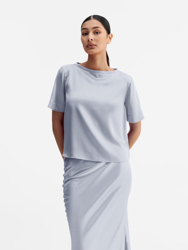 Model wearing Ahlvar Gallery Lola satin tee denim blue
