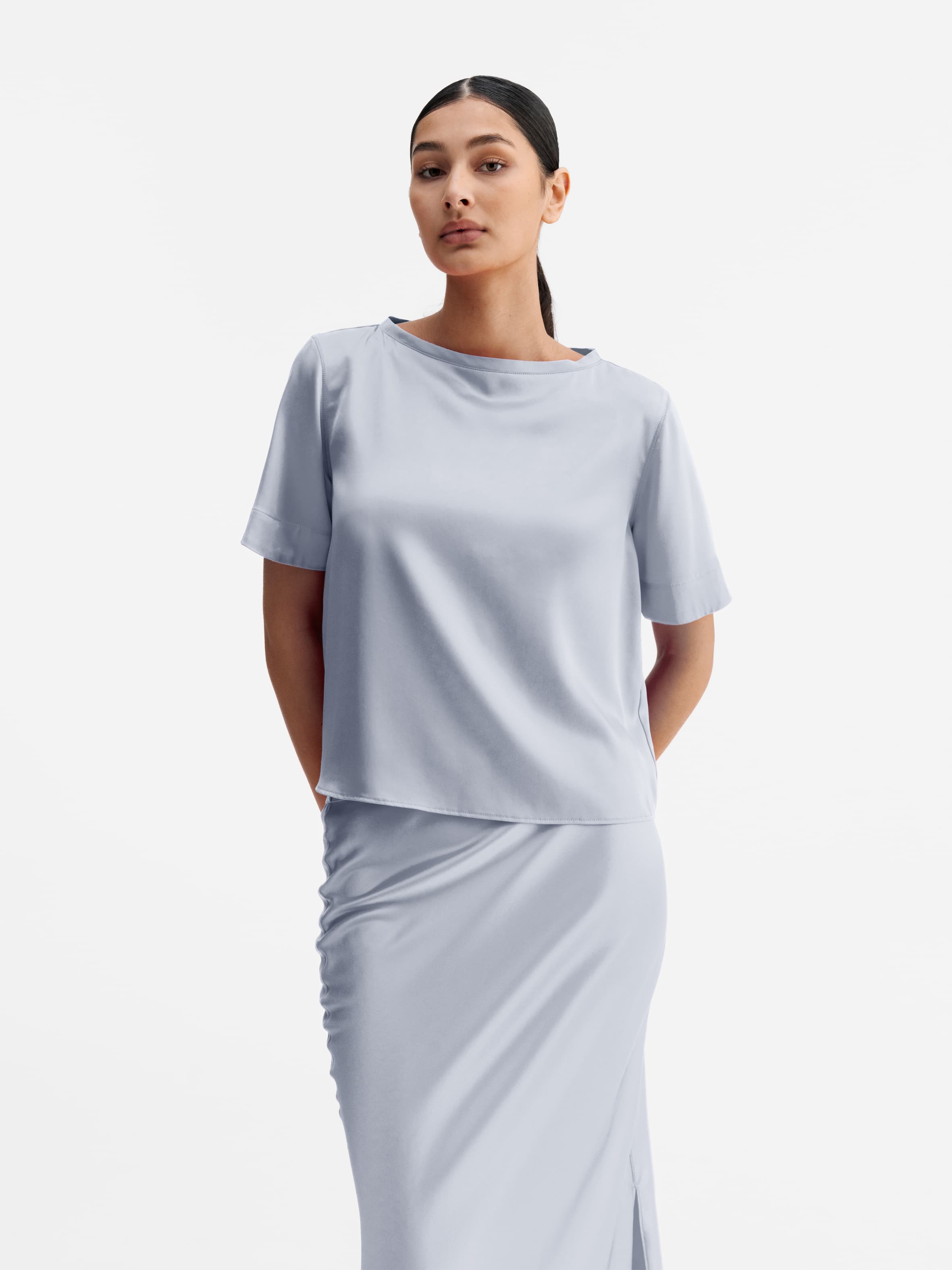 Model wearing Ahlvar Gallery Lola satin tee denim blue