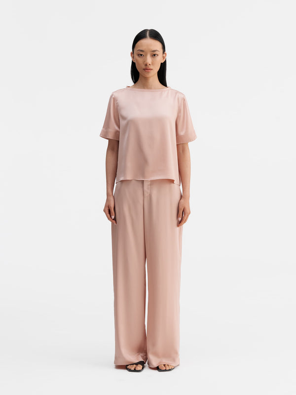Model wearing Ahlvar Gallery Lola satin tee dusty pink