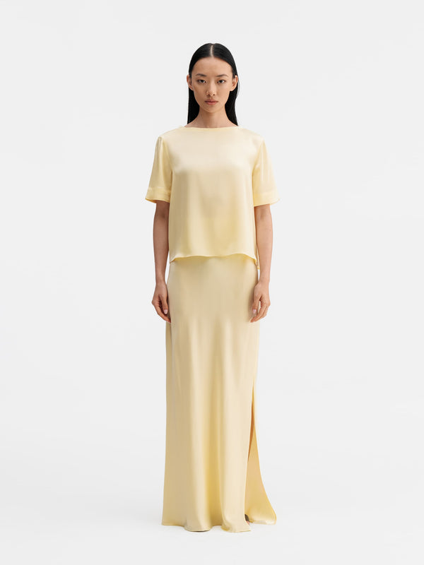 Model wearing Ahlvar Gallery Lola satin tee light yellow