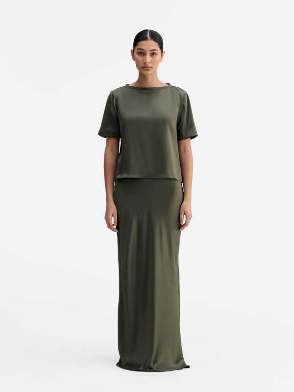 Model wearing Ahlvar Gallery Lola satin tee olive green
