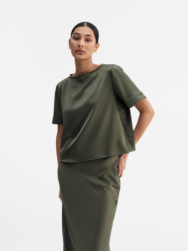 Model wearing Ahlvar Gallery Lola satin tee olive green