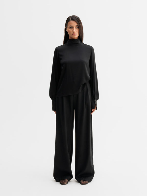 Model wearing Ahlvar Gallery Luna silk blouse in Black