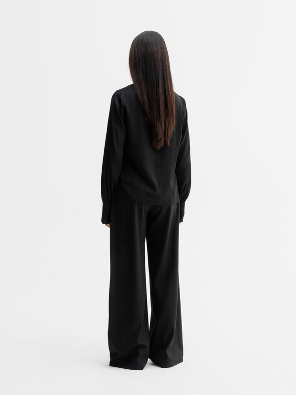Back view of Ahlvar Gallery Luna silk blouse in Black