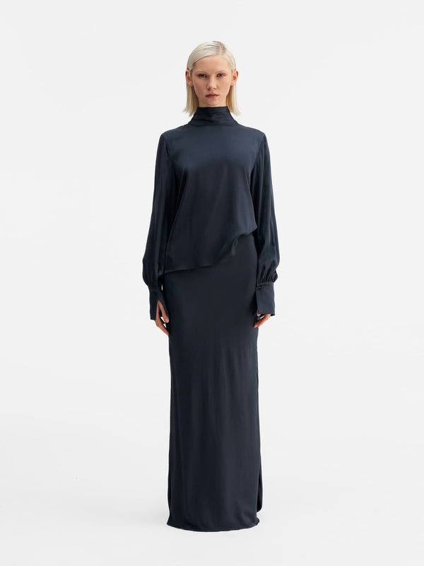 Model wearing Ahlvar Gallery Luna silk blouse blue grey