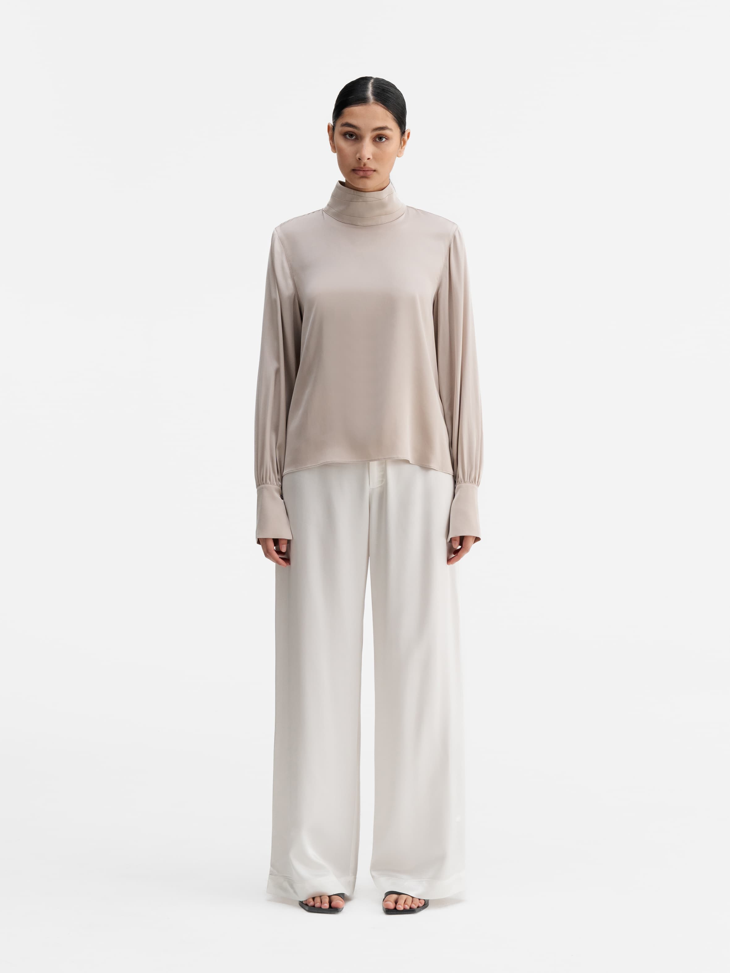 Model wearing Ahlvar Gallery Luna silk blouse greige
