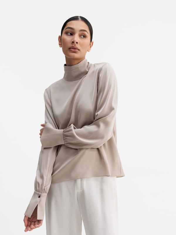 Model wearing Ahlvar Gallery Luna silk blouse greige