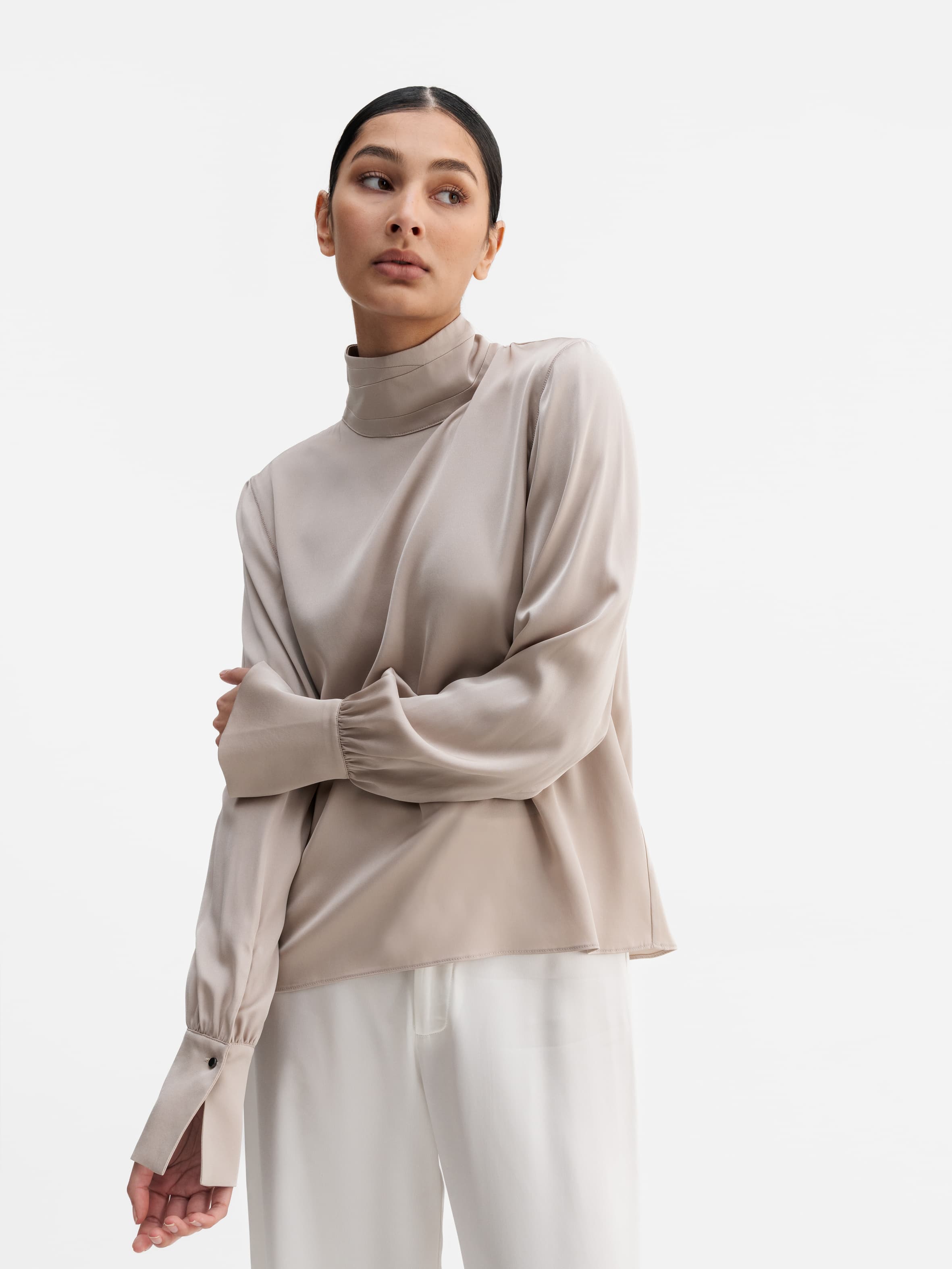Model wearing Ahlvar Gallery Luna silk blouse greige