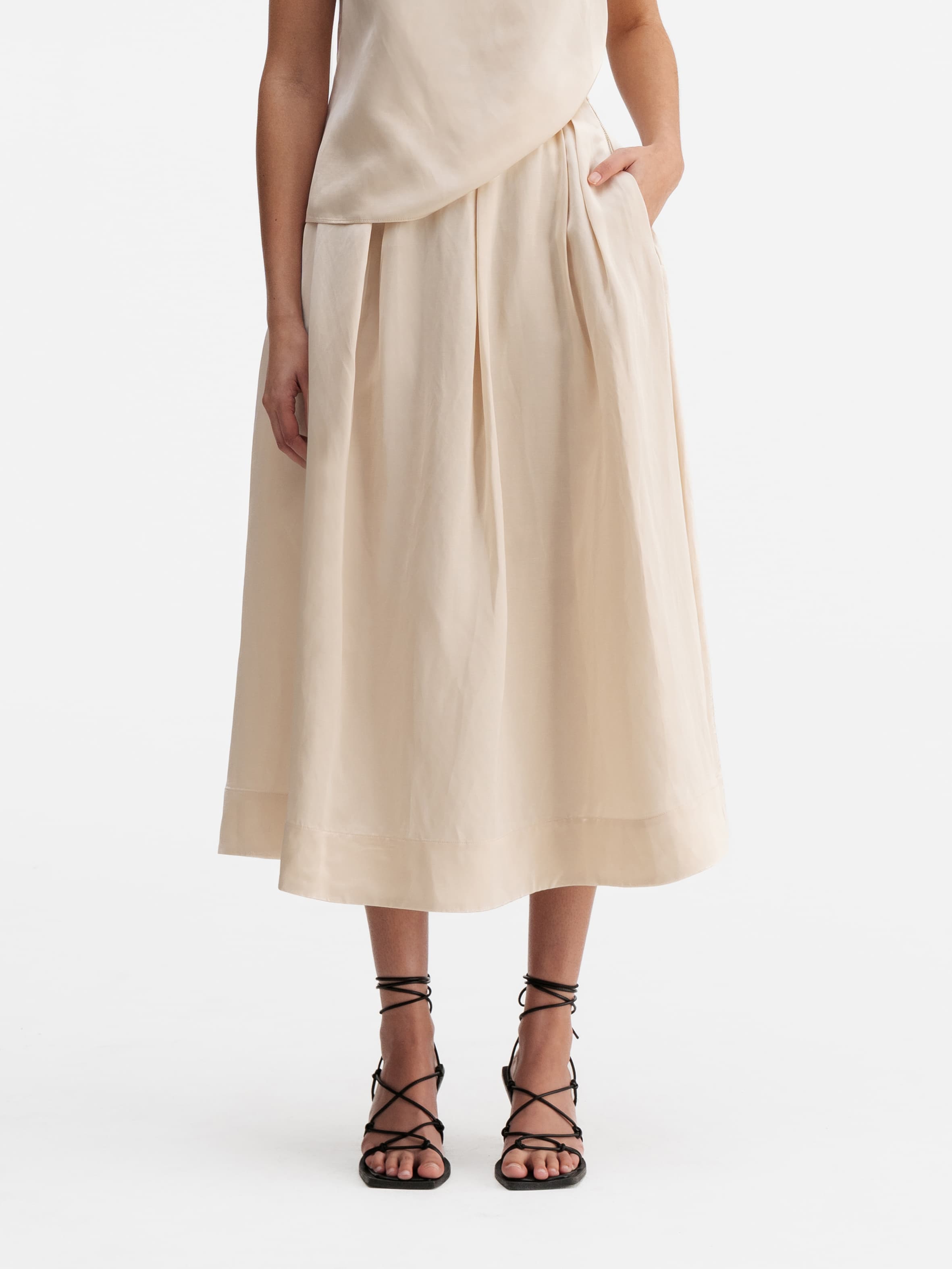 Model wearing Ahlvar Gallery Mace linen skirt cream