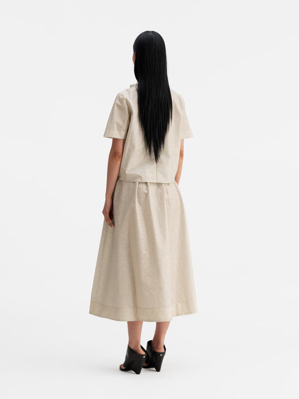 Back view of Ahlvar Gallery Mace shimmer skirt cream