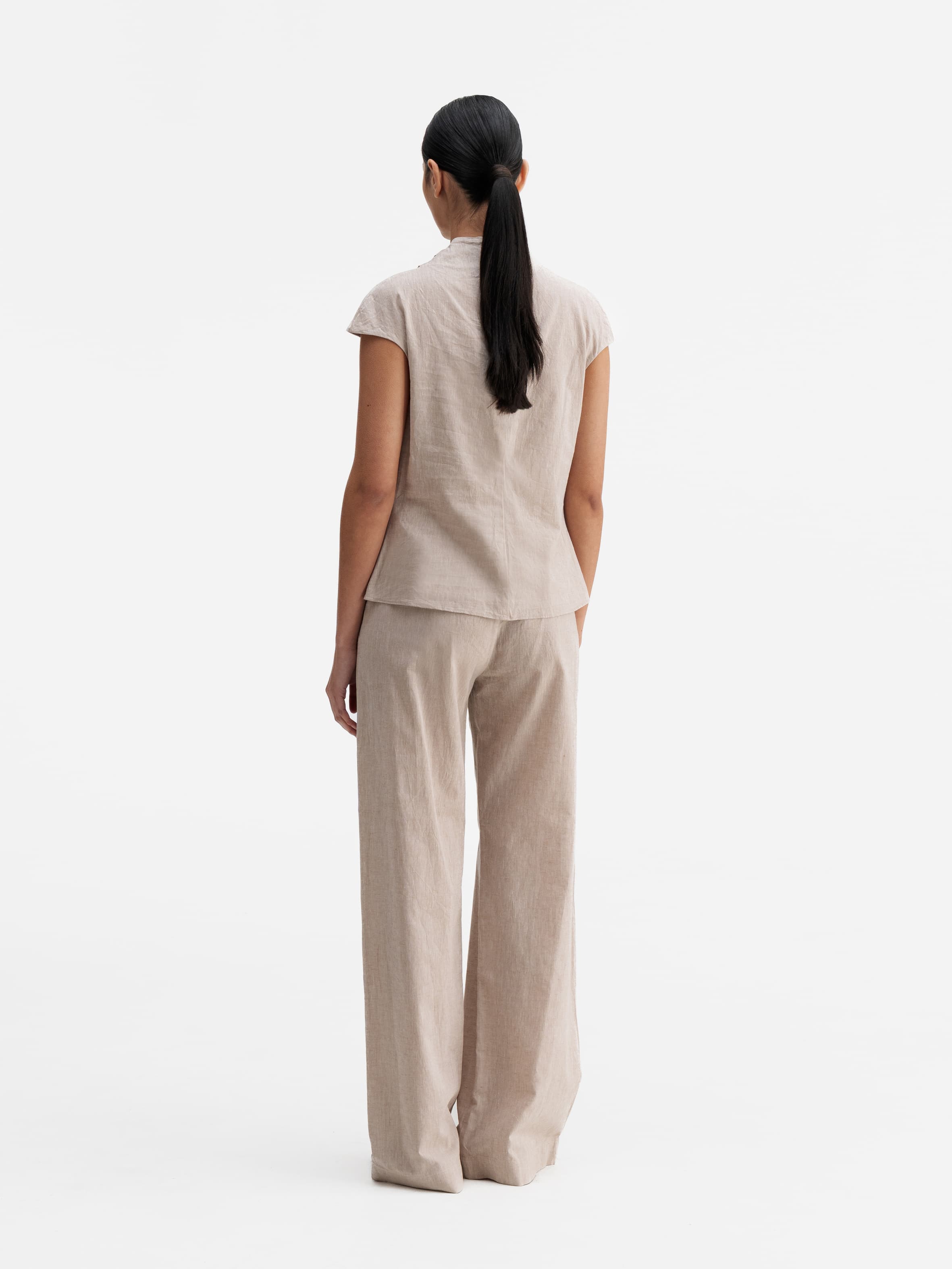 Back view of Ahlvar Gallery Meya linen trousers cream