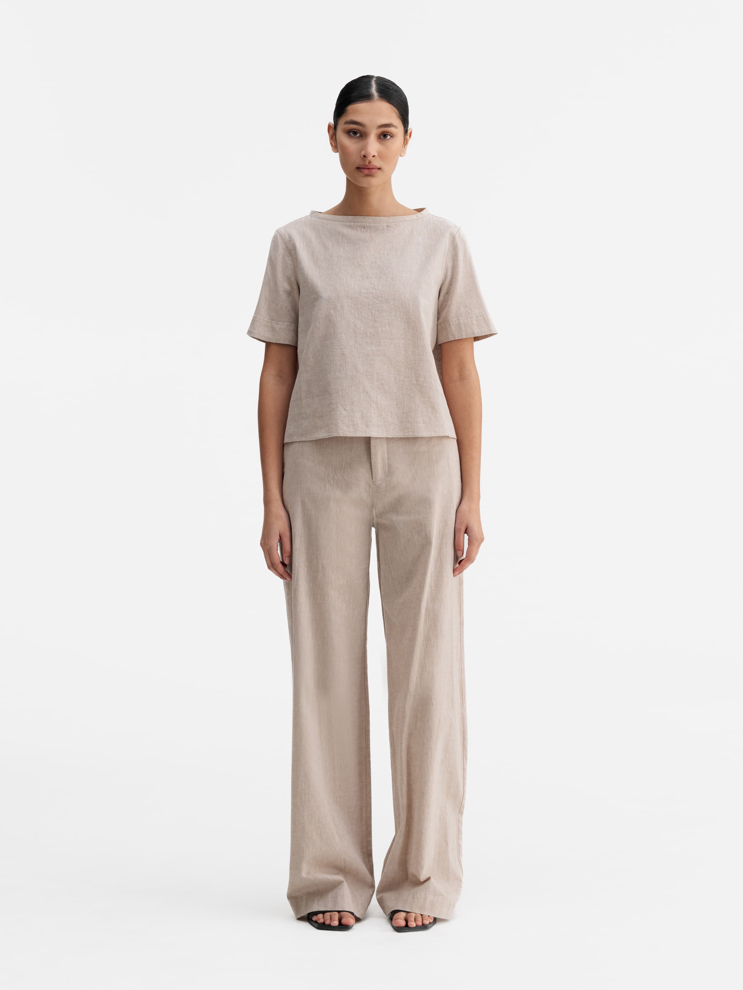 Model wearing Ahlvar Gallery Meya linen trousers cream
