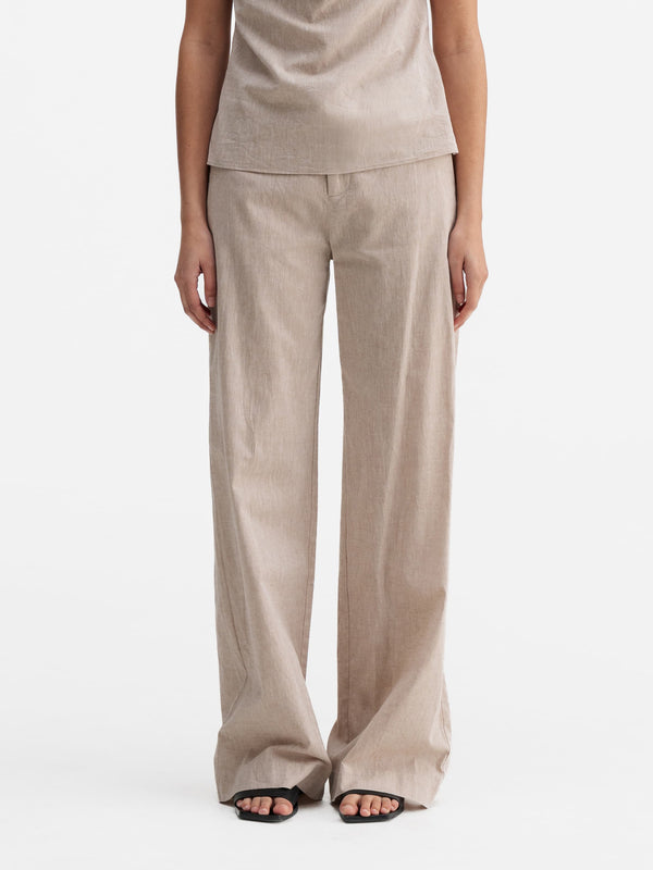 Model wearing Ahlvar Gallery Meya linen trousers cream