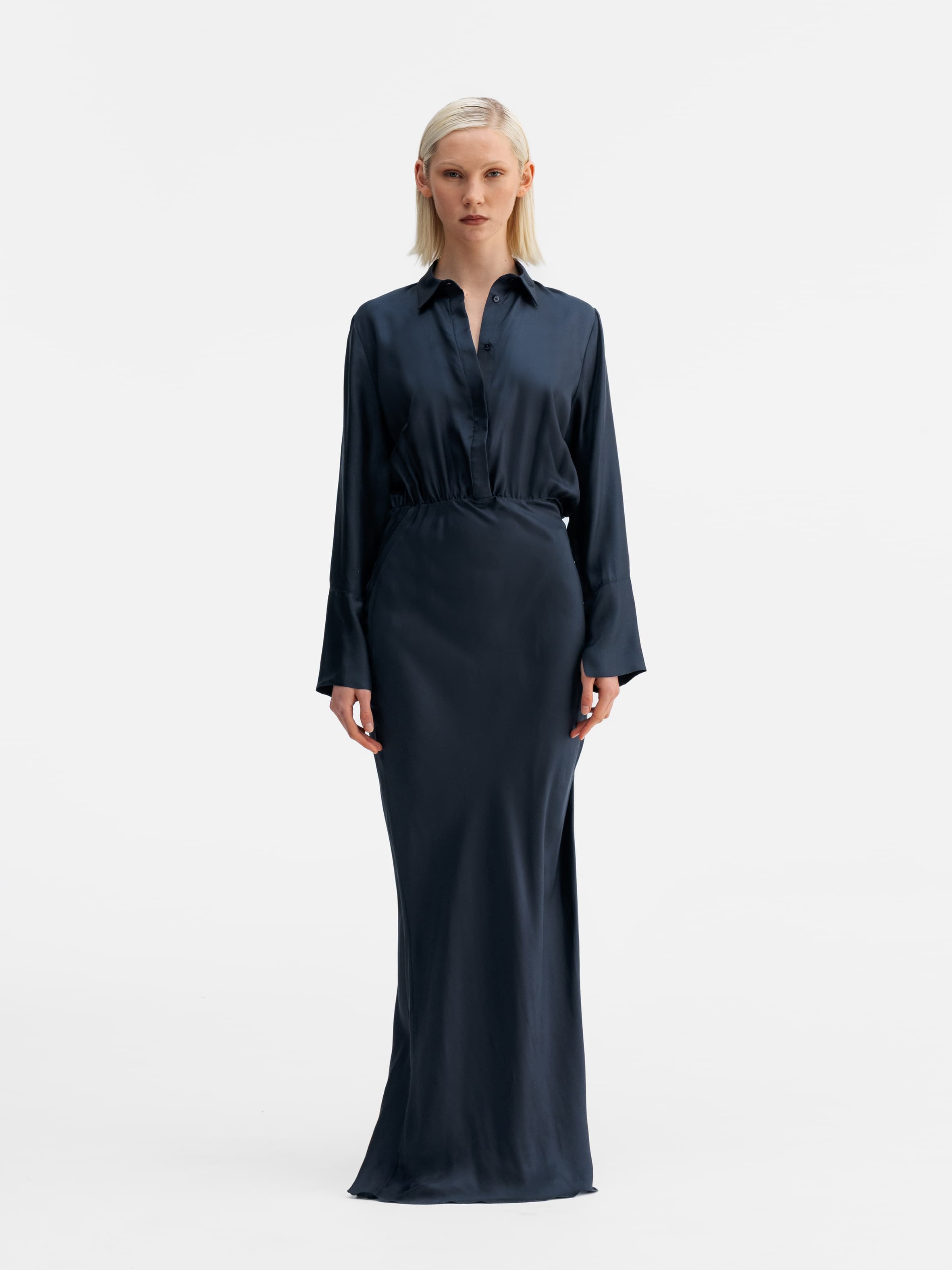 Model wearing Ahlvar Gallery Mia silk twill dress blue grey