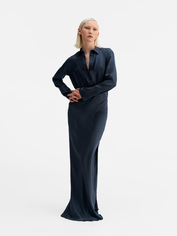Model wearing Ahlvar Gallery Mia silk twill dress blue grey