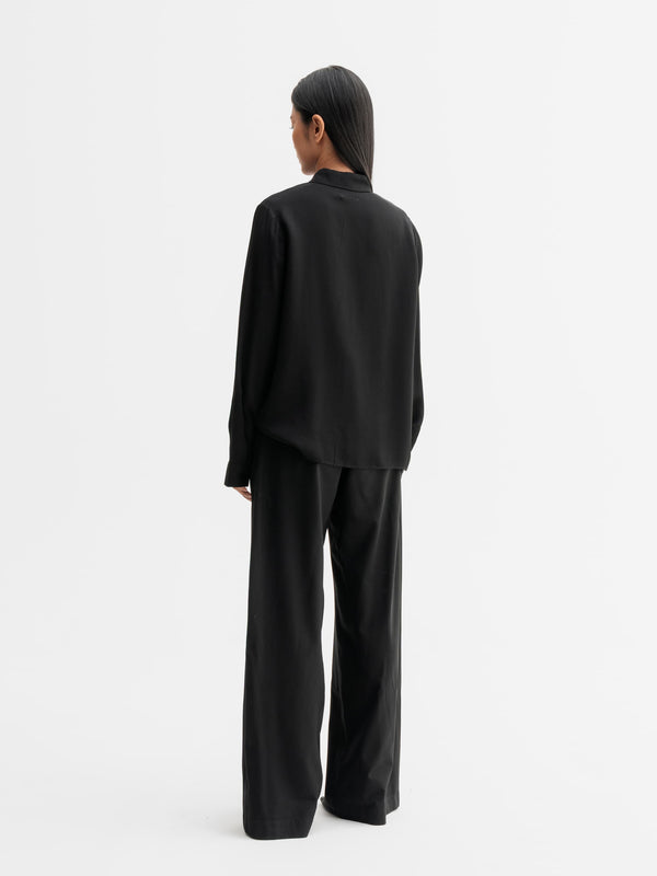 Back view of Ahlvar Gallery Mia silk shirt in Black