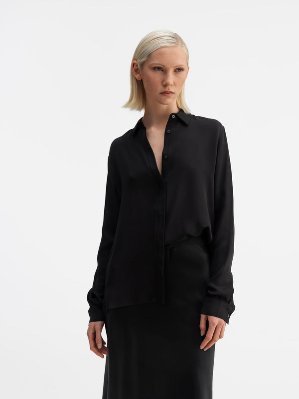 Model wearing Ahlvar Gallery Mia silk shirt black