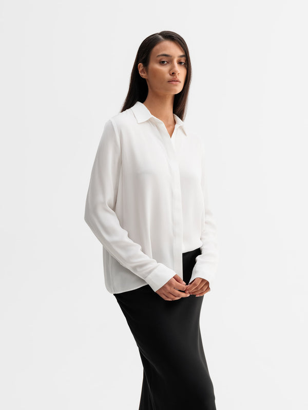 Model wearing Ahlvar Gallery Mia silk shirt in White