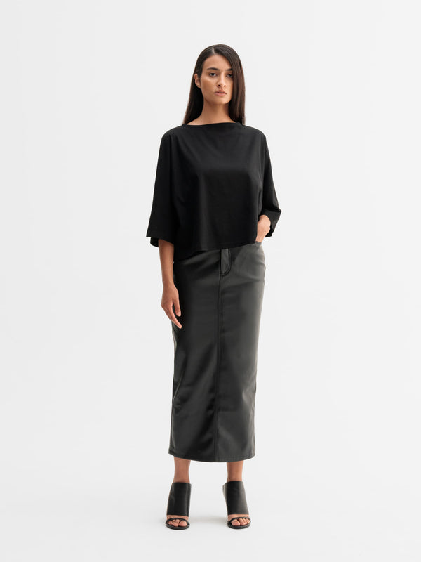 Model wearing Ahlvar Gallery Mika PU leather skirt in Black