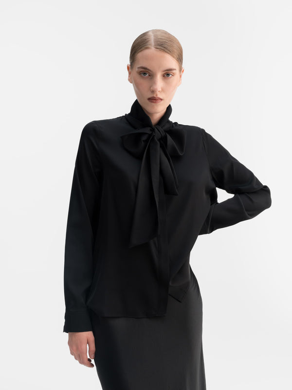 Model wearing Ahlvar Gallery Miki silk blouse in Black