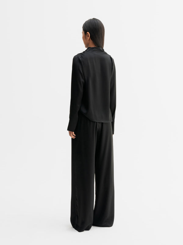 Back view of Ahlvar Gallery Miko satin blouse in Black