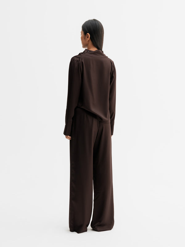 Back view of Ahlvar Gallery Mila satin trousers in Dark brown