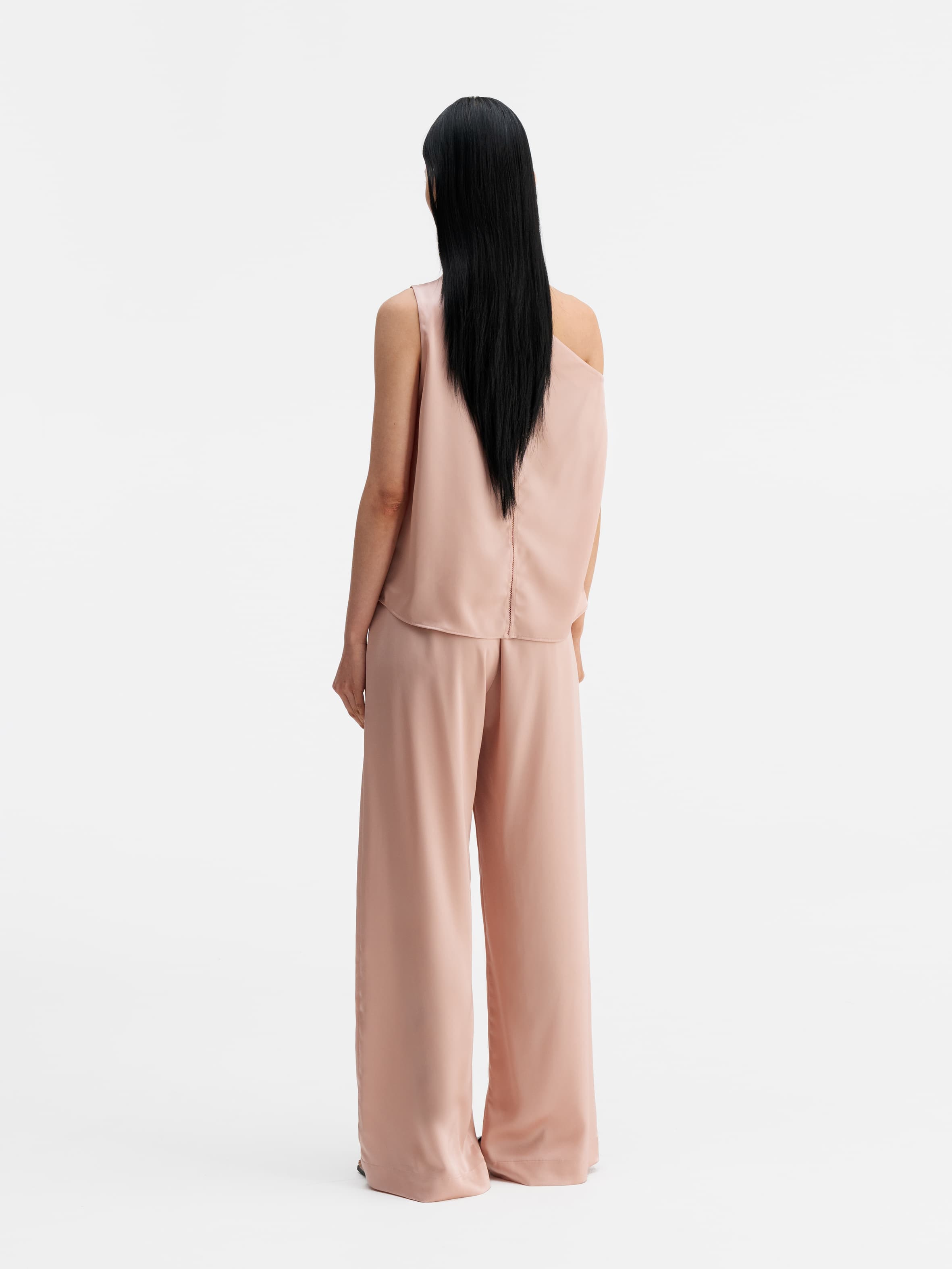 Back view of Ahlvar Gallery Mila satin trousers dusty pink