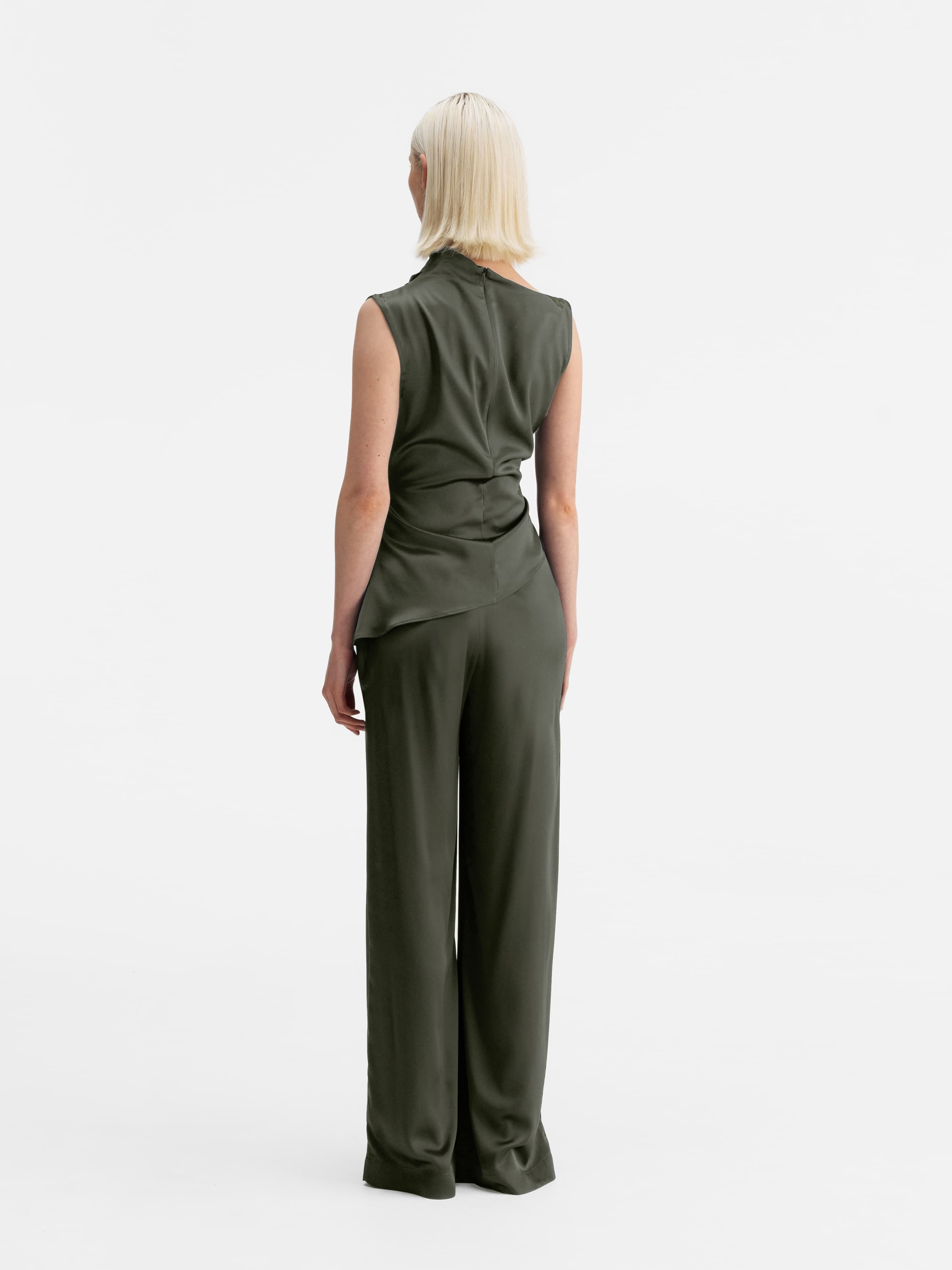 Back view of Ahlvar Gallery Mila satin trousers olive green