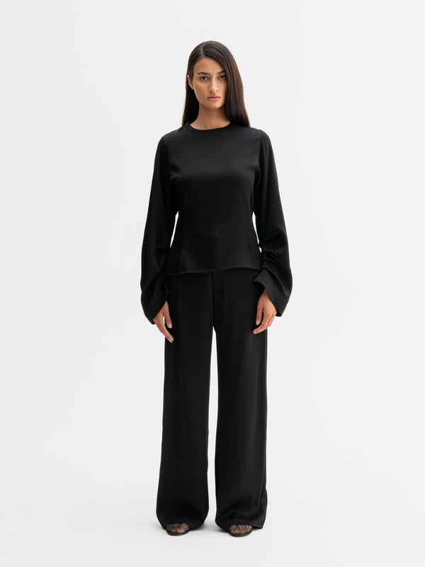 Model wearing Ahlvar Gallery Mila trousers in Black