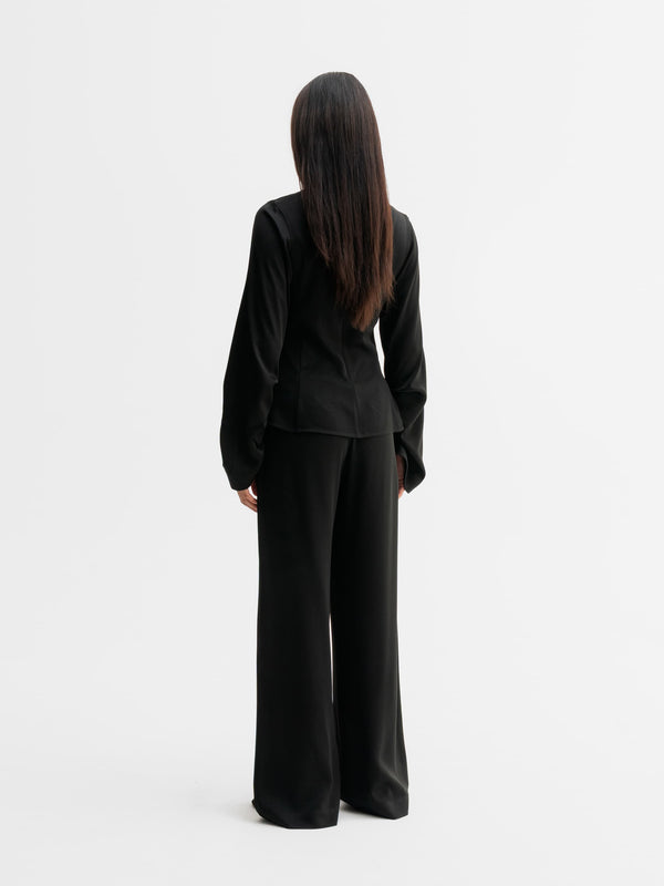 Back view of Ahlvar Gallery Mila trousers in Black
