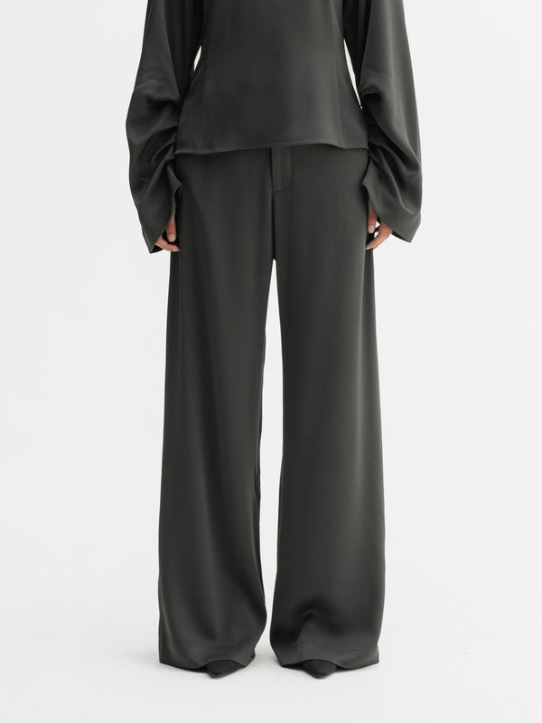 Model wearing Ahlvar Gallery Mila trousers in Wood