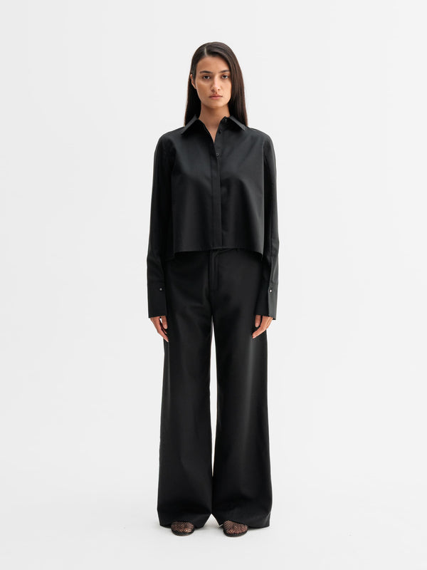 Model wearing Ahlvar Gallery Mila wool trousers in Black