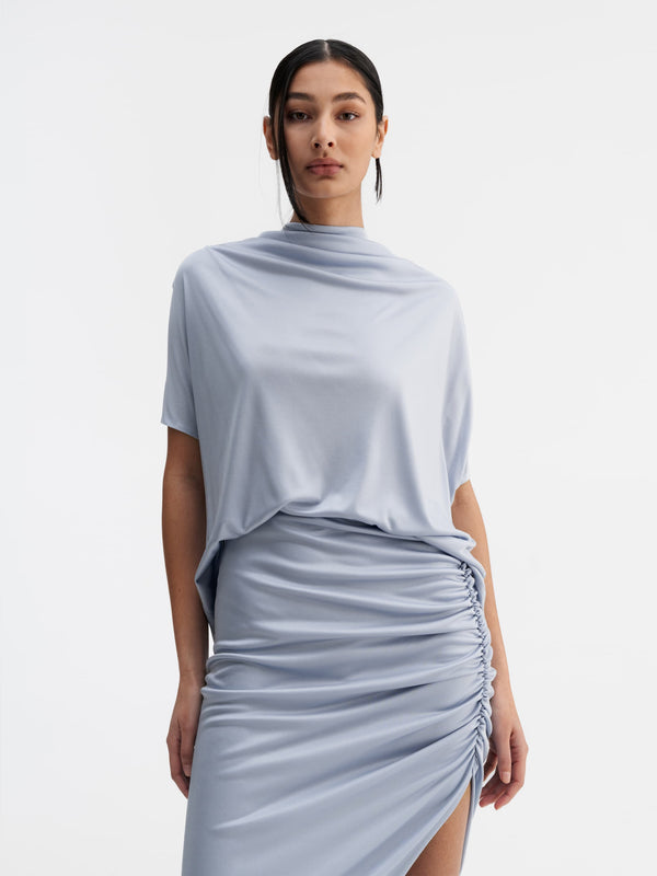 Model wearing Ahlvar Gallery Milly jersey top denim blue
