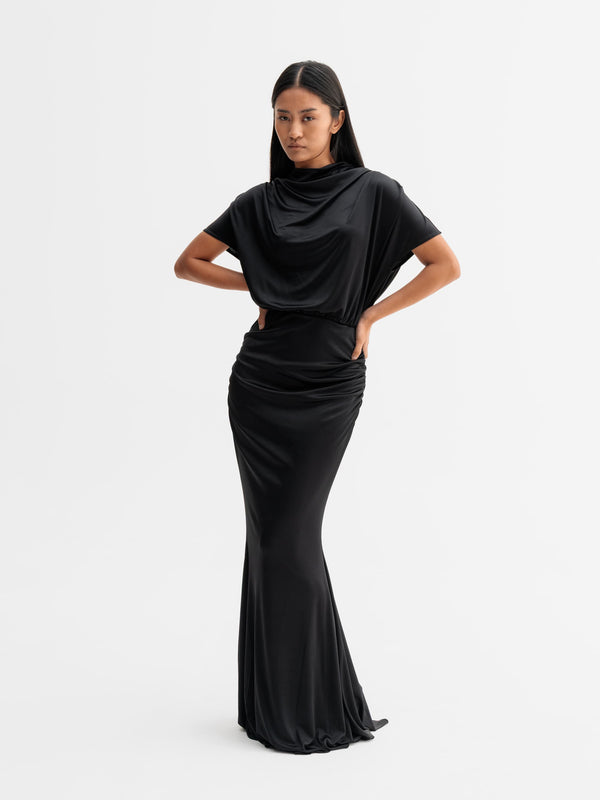 Model wearing Ahlvar Gallery Miya jersey dress in Black