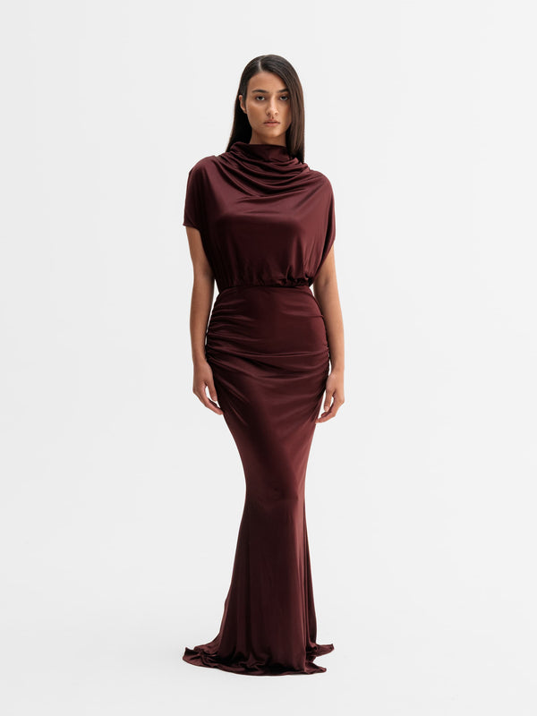Model wearing Ahlvar Gallery Miya jersey dress in Burgundy