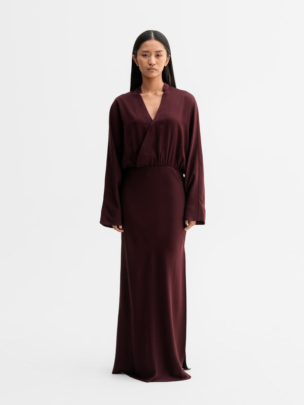 Model wearing Ahlvar Gallery Niva dress in Burgundy