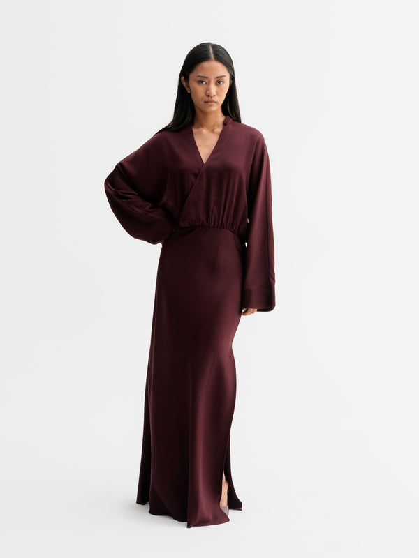 Model wearing Ahlvar Gallery Niva dress in Burgundy