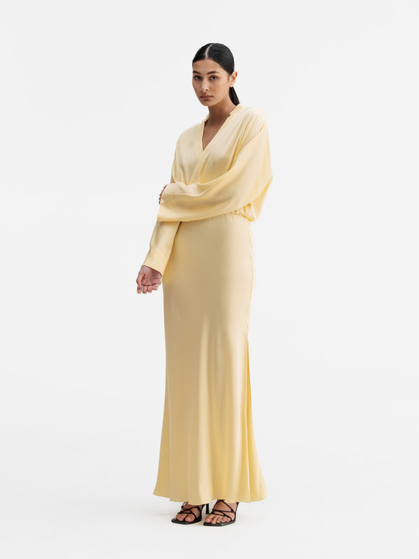 Model wearing Ahlvar Gallery Niva dress light yellow