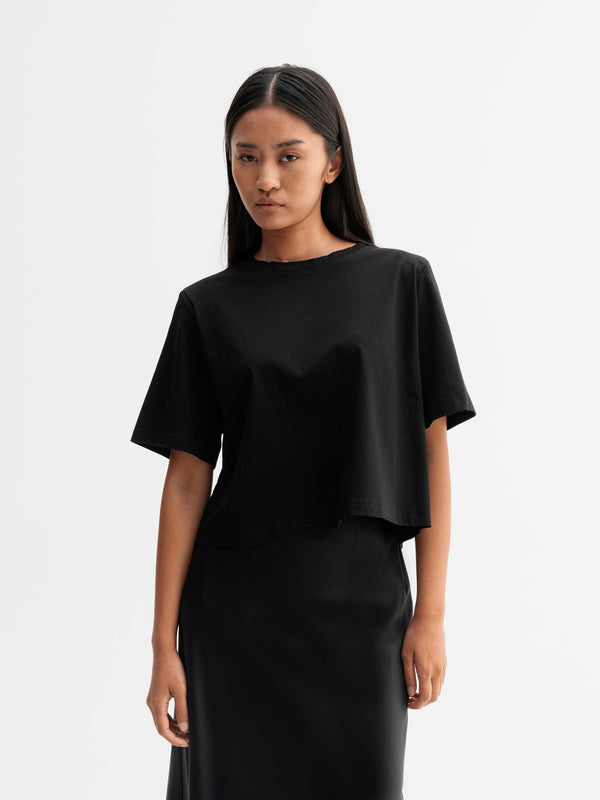 Model wearing Ahlvar Gallery Okaya cropped tee in Black