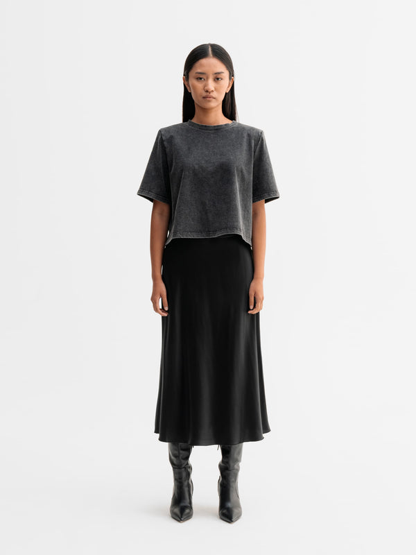Model wearing Ahlvar Gallery Okaya cropped tee in Washed black