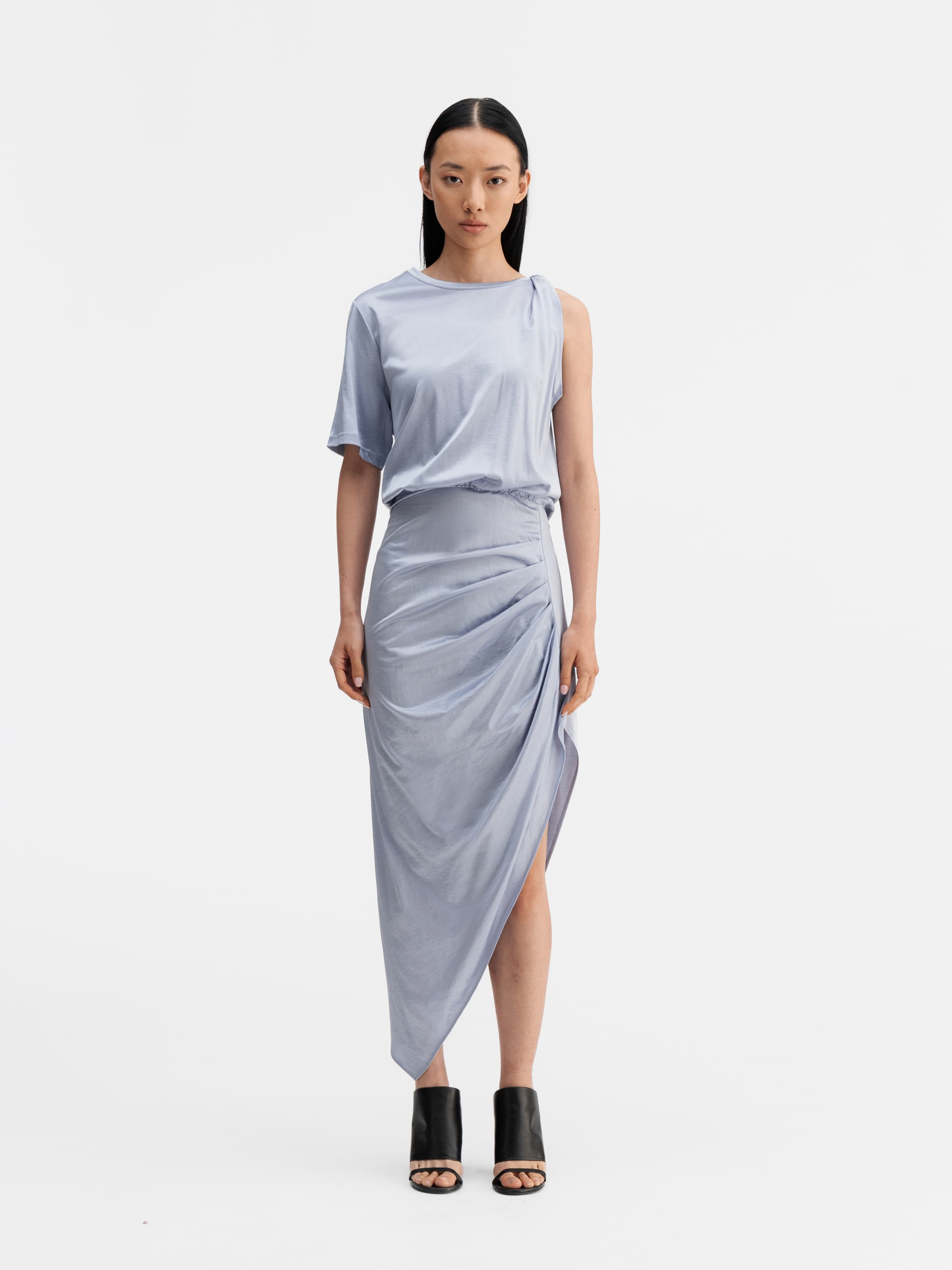 Model wearing Ahlvar Gallery Oki twisted dress denim blue