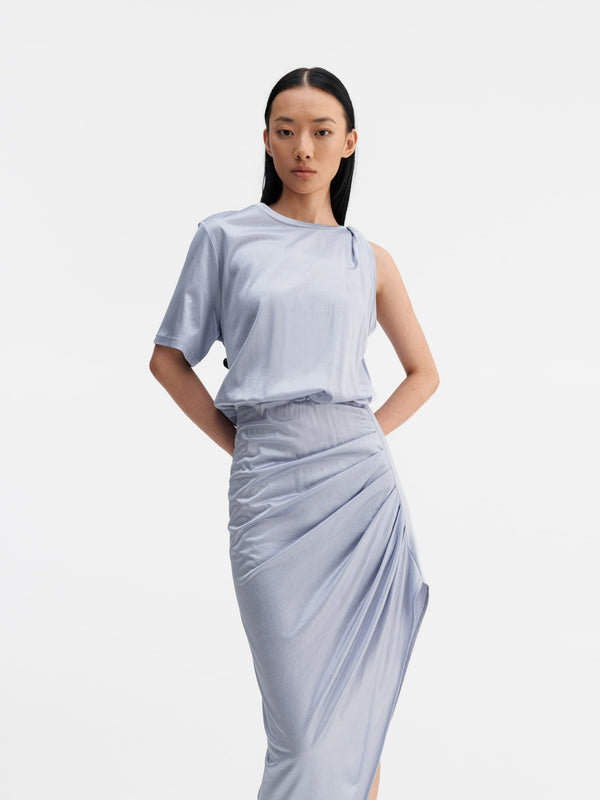 Model wearing Ahlvar Gallery Oki twisted dress denim blue