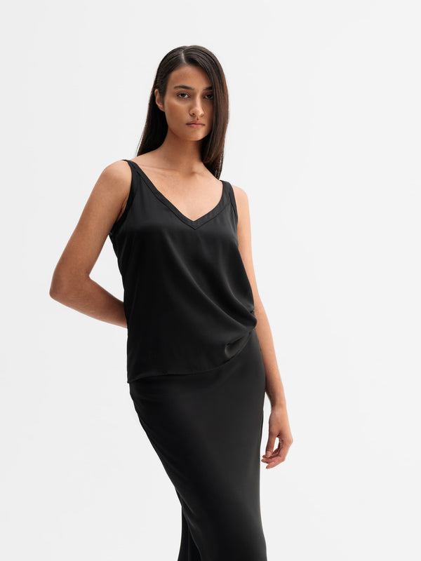 Model wearing Ahlvar Gallery Shin silk tank in Black