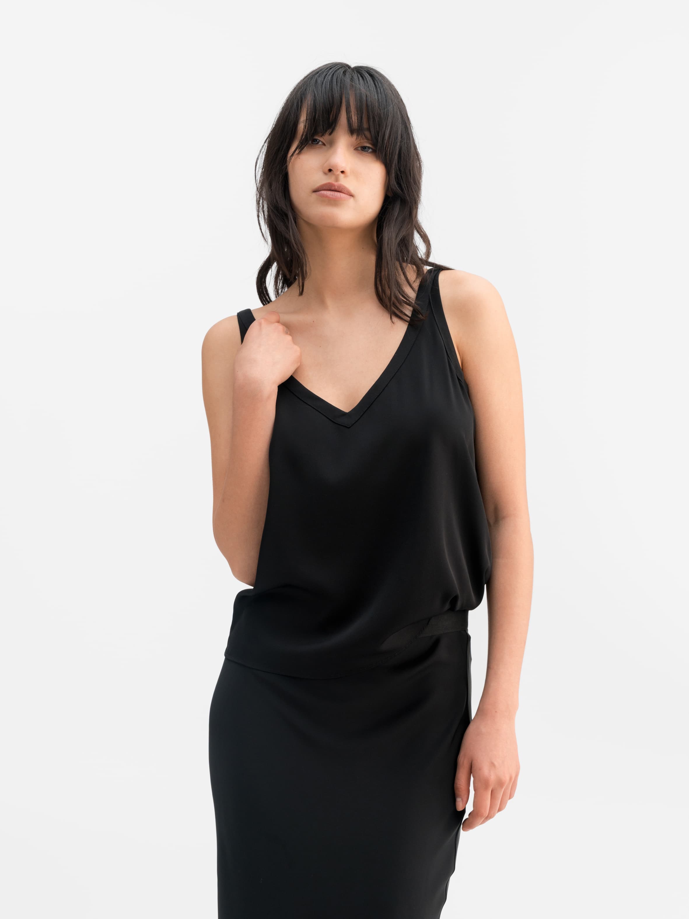 Model wearing Ahlvar Gallery Shin silk tank black