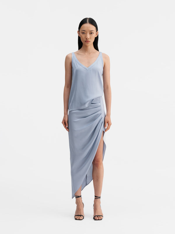 Model wearing Ahlvar Gallery Shin silk tank denim blue