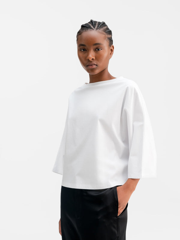 Model wearing Ahlvar Gallery Thea jersey tee in White
