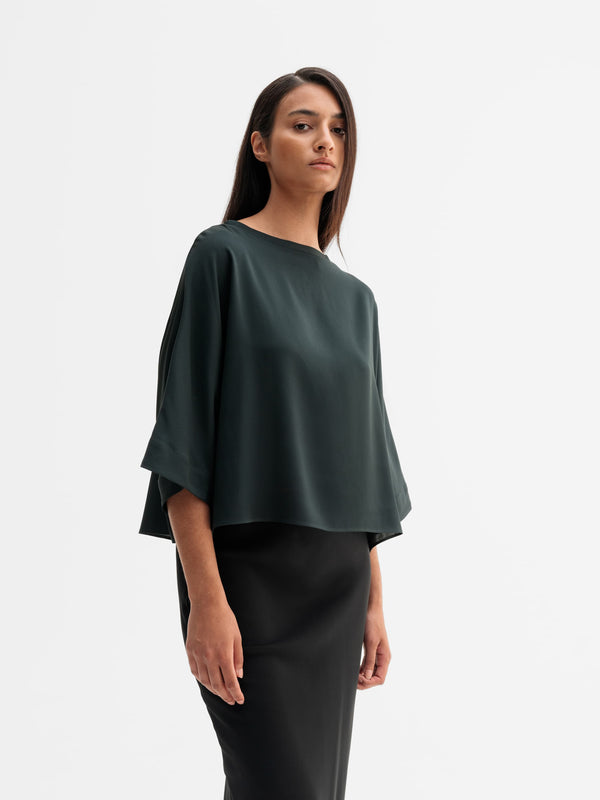 Model wearing Ahlvar Gallery Thea silk tee in Deep forest